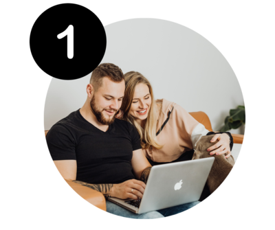 Couple booking an appointment online with laptop